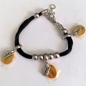 New charm bracelet.  Love, Faith, Dream, Believe.   7" + 1"  long.  Gift box
